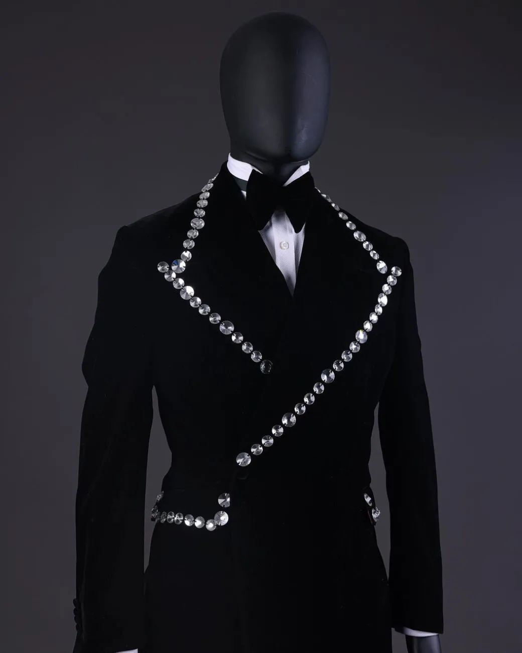 A Reloaded “Herd” Charcoal Black Soaked Velvet Peak Lapel Wrap Tuxedo Suit