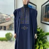 A reloaded midnight blue, connected square embroidery design with matching gold and red Swarovski stone details agbada