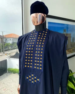 A reloaded midnight blue, connected square embroidery design with matching gold and red Swarovski stone details agbada
