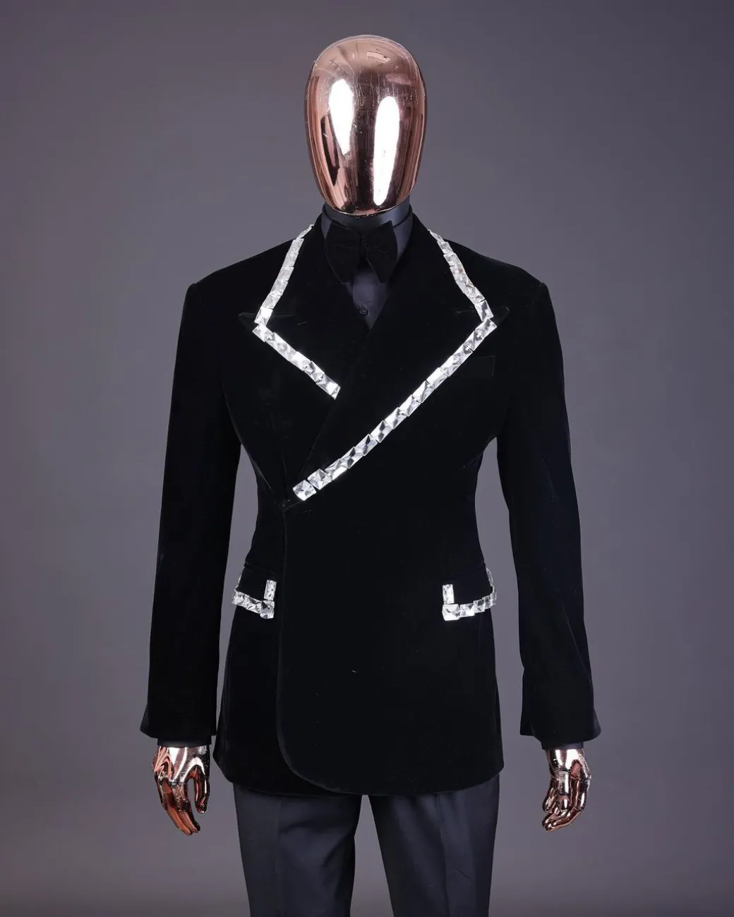 A reloaded monochrome “herd” charcoal black soaked velvet peak lapel wrap tuxedo suit