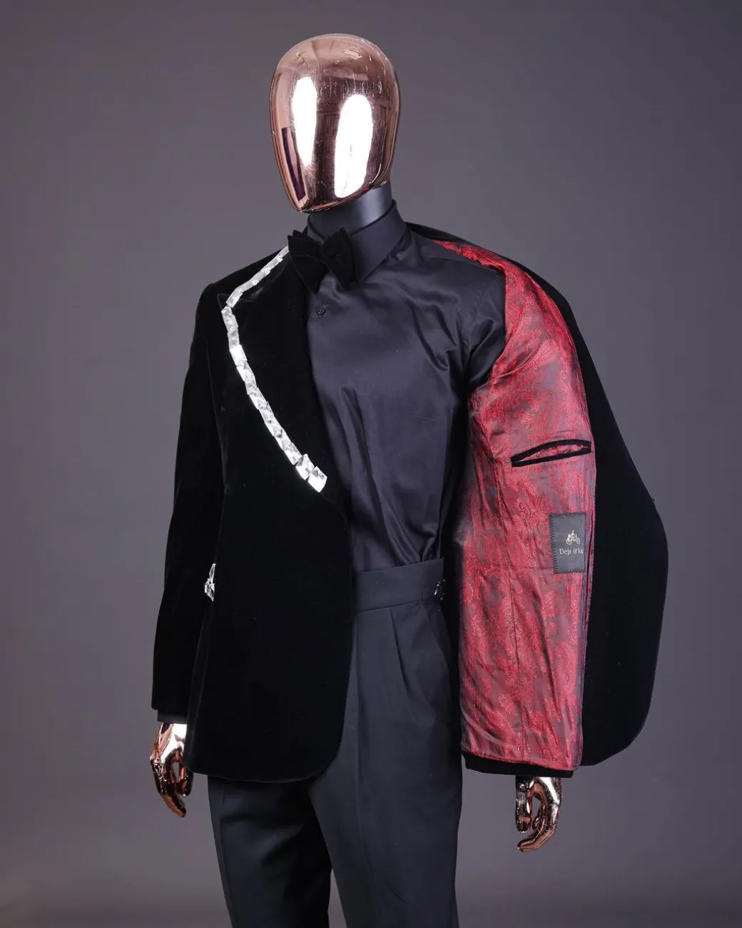 A reloaded monochrome “herd” charcoal black soaked velvet peak lapel wrap tuxedo suit