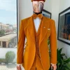 A reloaded monochrome “peaky blinders” hand knitted soaked Italian velvet ochre yellow peak lapel suit
