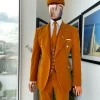 A reloaded monochrome “peaky blinders” hand knitted soaked Italian velvet ochre yellow peak lapel suit