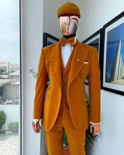A reloaded monochrome “peaky blinders” hand knitted soaked Italian velvet ochre yellow peak lapel suit