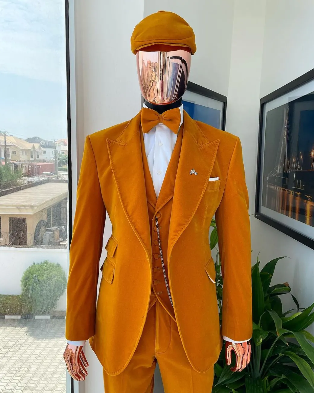 A reloaded monochrome “peaky blinders” hand knitted soaked Italian velvet ochre yellow peak lapel suit
