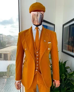 A reloaded monochrome “peaky blinders” hand knitted soaked Italian velvet ochre yellow peak lapel suit