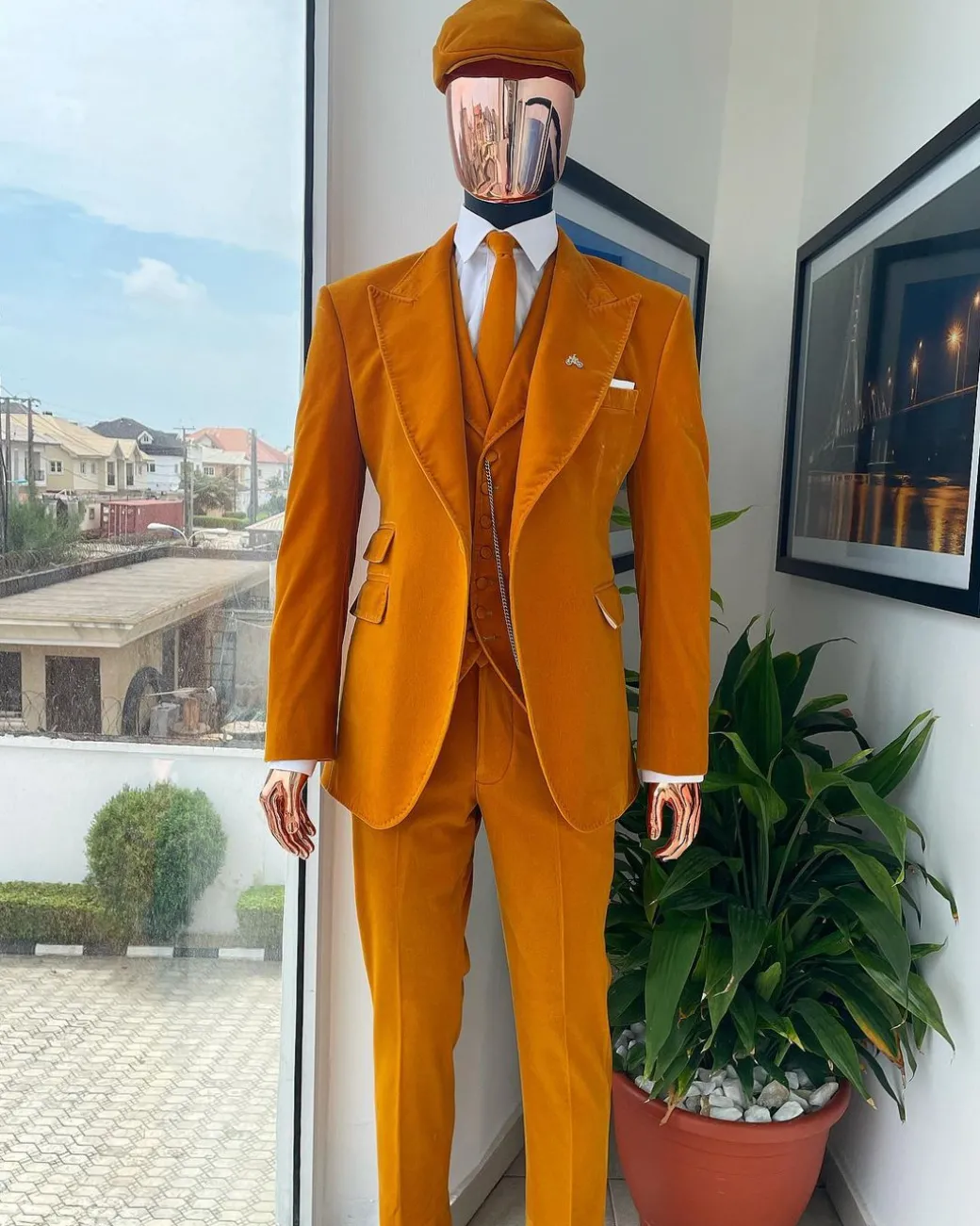 A reloaded monochrome “peaky blinders” hand knitted soaked Italian velvet ochre yellow peak lapel suit