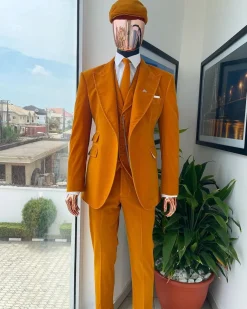 A reloaded monochrome “peaky blinders” hand knitted soaked Italian velvet ochre yellow peak lapel suit