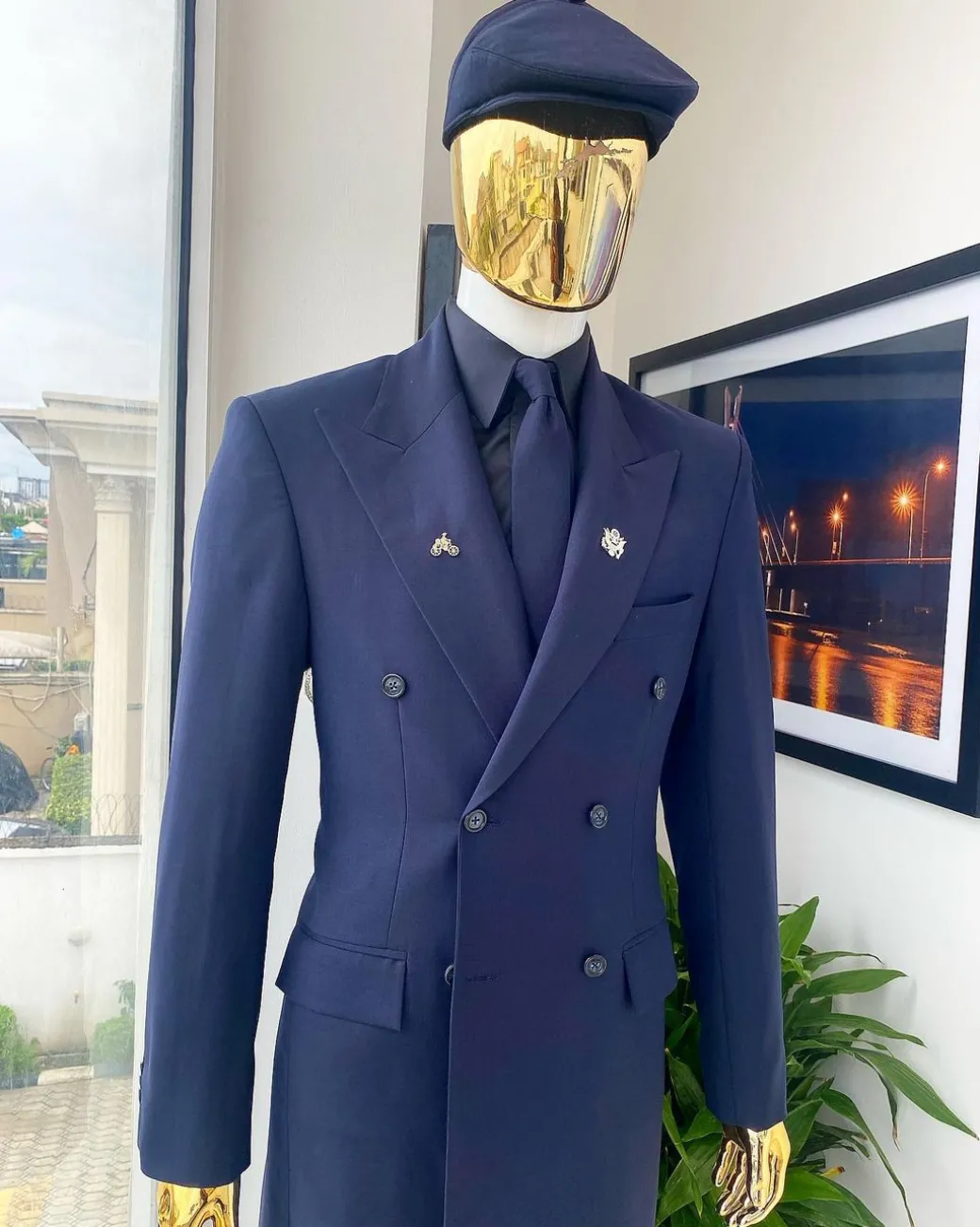 A reloaded monochrome “peaky Blinder” midnight blue peak lapel trench suit