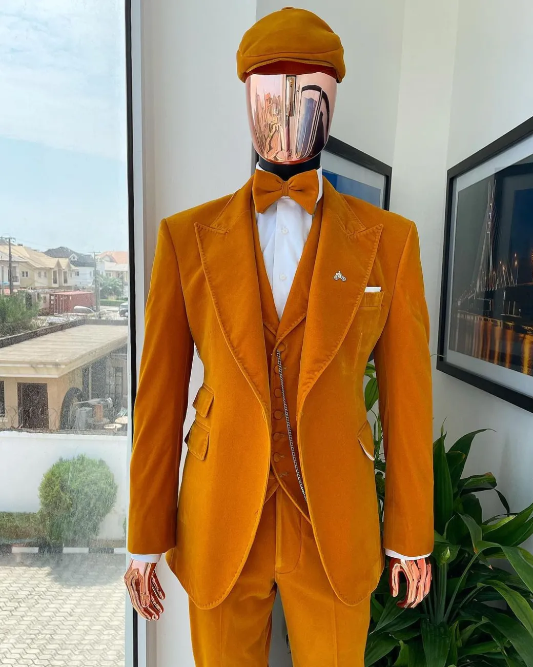 A reloaded monochrome “peaky blinders” hand knitted soaked Italian velvet ochre yellow peak lapel suit