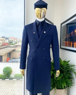 A reloaded monochrome “peaky Blinder” midnight blue peak lapel trench suit
