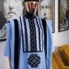 A Reloaded sky blue Monochrome embroidery with navy blue soaked Italian velvet detailing agbada