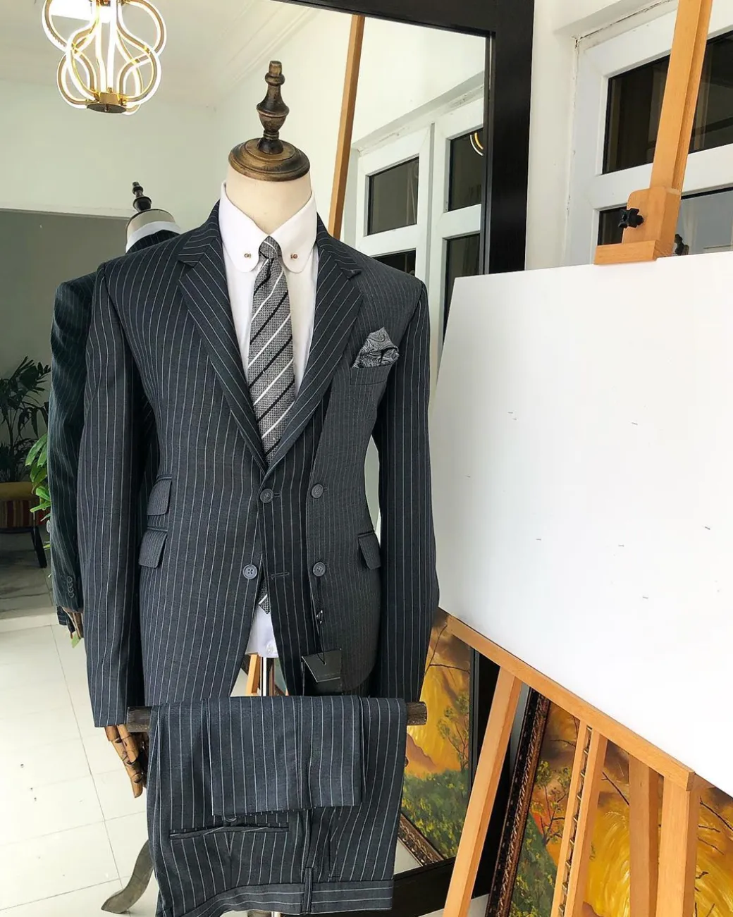 A Revolutionary “Catch Me If You Can” Grey Bold Pencil Stripe notch lapel double side-breasted Suit.
