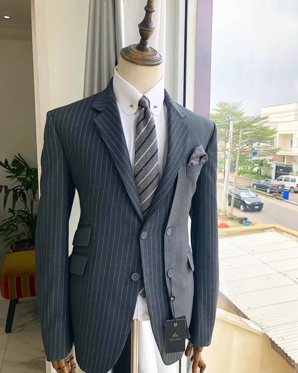 A Revolutionary “Catch Me If You Can” Grey Bold Pencil Stripe notch lapel double side-breasted Suit.