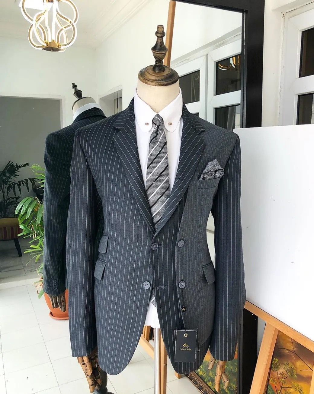 A Revolutionary “Catch Me If You Can” Grey Bold Pencil Stripe notch lapel double side-breasted Suit.