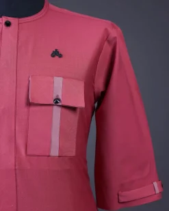 A Rogue pink, Front flap with black Swarovski button, 3/4 sleeve with combat patch pocket details African senator kaftan native.
