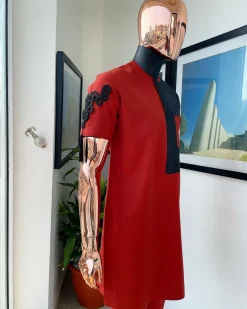 A Rosso corsa red, half cut black paisley detailing with mandarin knot button detailing african traditional senator kaftan native