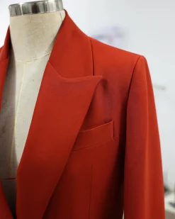 A Rust Orange Peak Lapel, Double-Breasted Jacket.