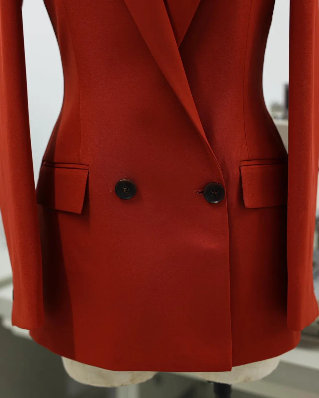 A Rust Orange Peak Lapel, Double-Breasted Jacket.