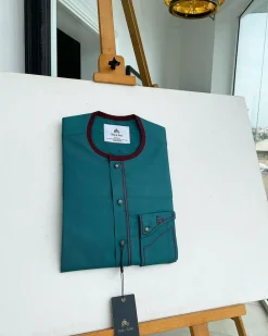 A Sacramento green, burgundy detailing, mixed-colour button details African traditional senator Kaftan native
