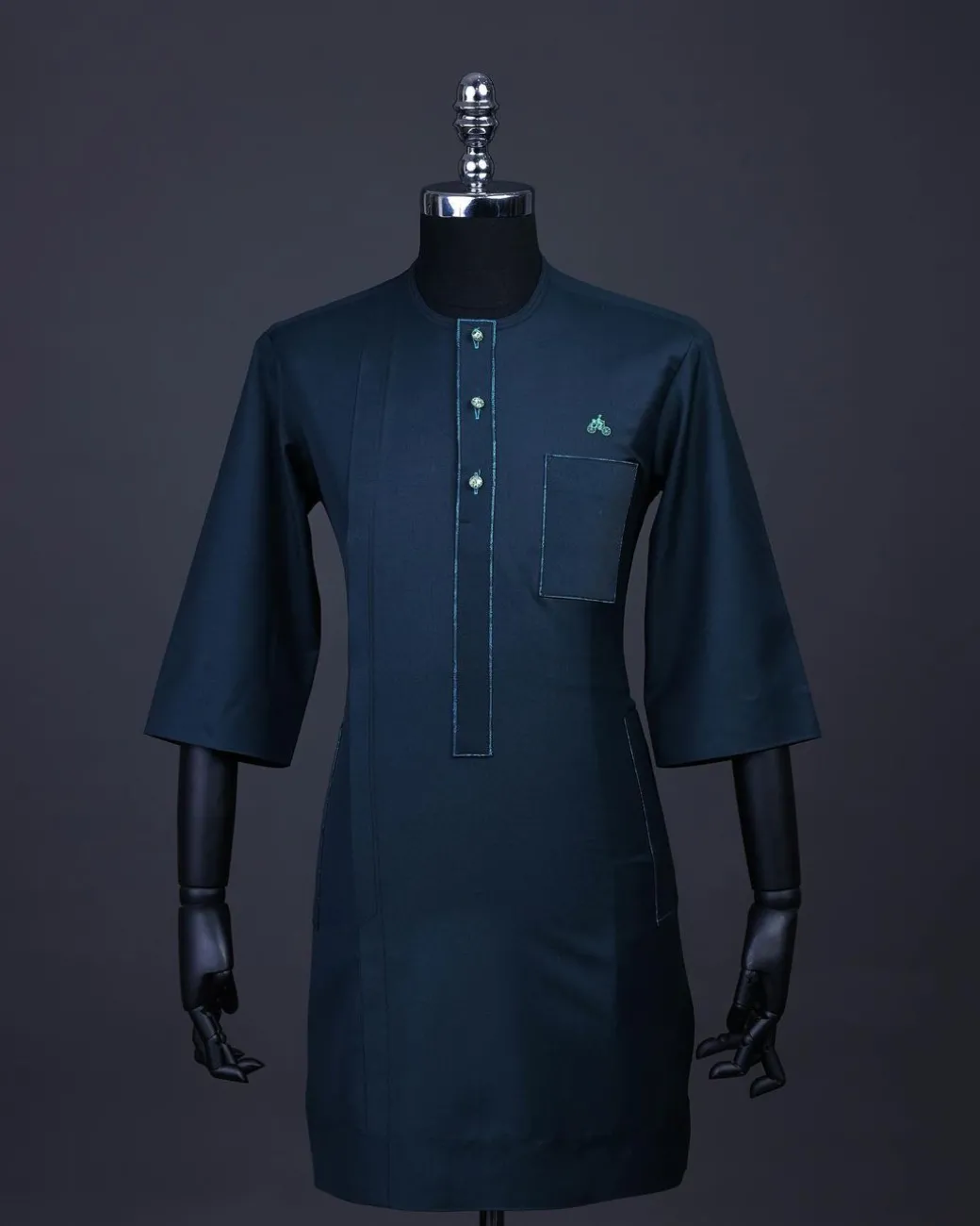 A Sacramento green, Front flap with green Swarovski buttons, patch pocket, 3/4 sleeve details African senator kaftan native.
