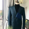 A Sacramento Green “Oranmiyan“ Double Breasted Peak Lapel Suit