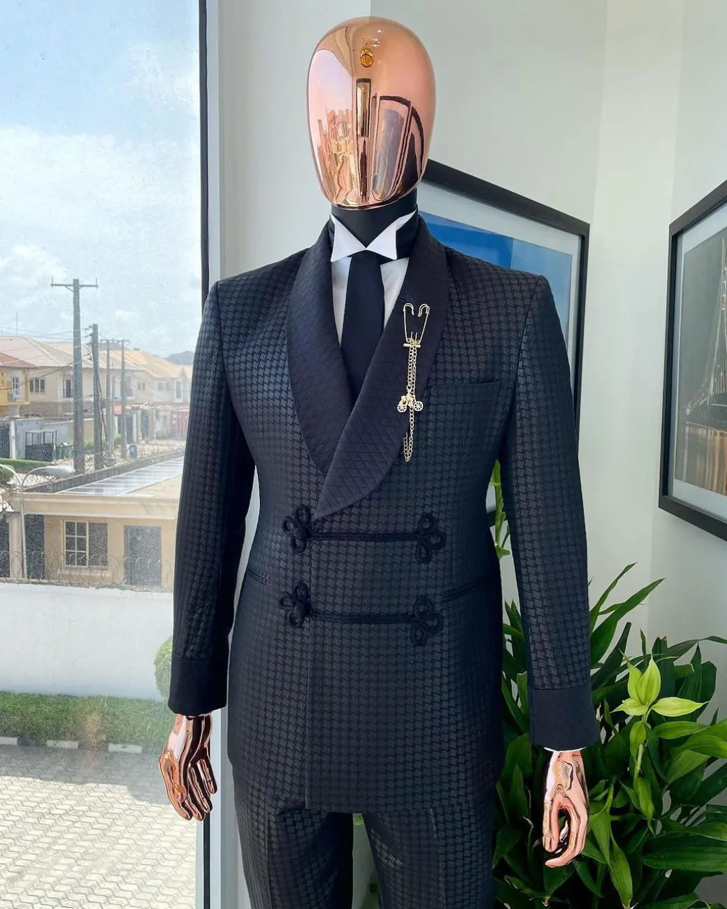 A “sajora” black inverted square patterned jacquard tuxedo suit