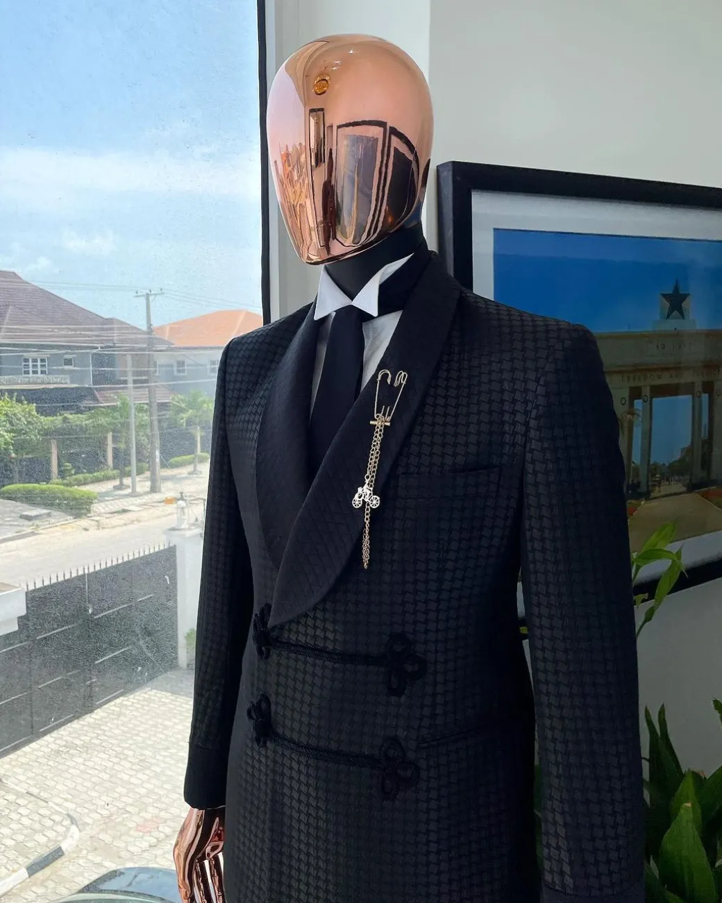 A “sajora” black inverted square patterned jacquard tuxedo suit