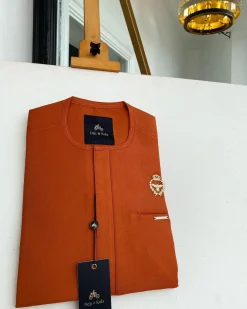 A Salamander orange, tiny flap with a gold queen bee crown details African traditional senator Kaftan native