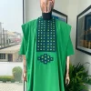A Shamrock green, connected square embroidery design with matching silver and parakeet green Swarovski stone details agbada