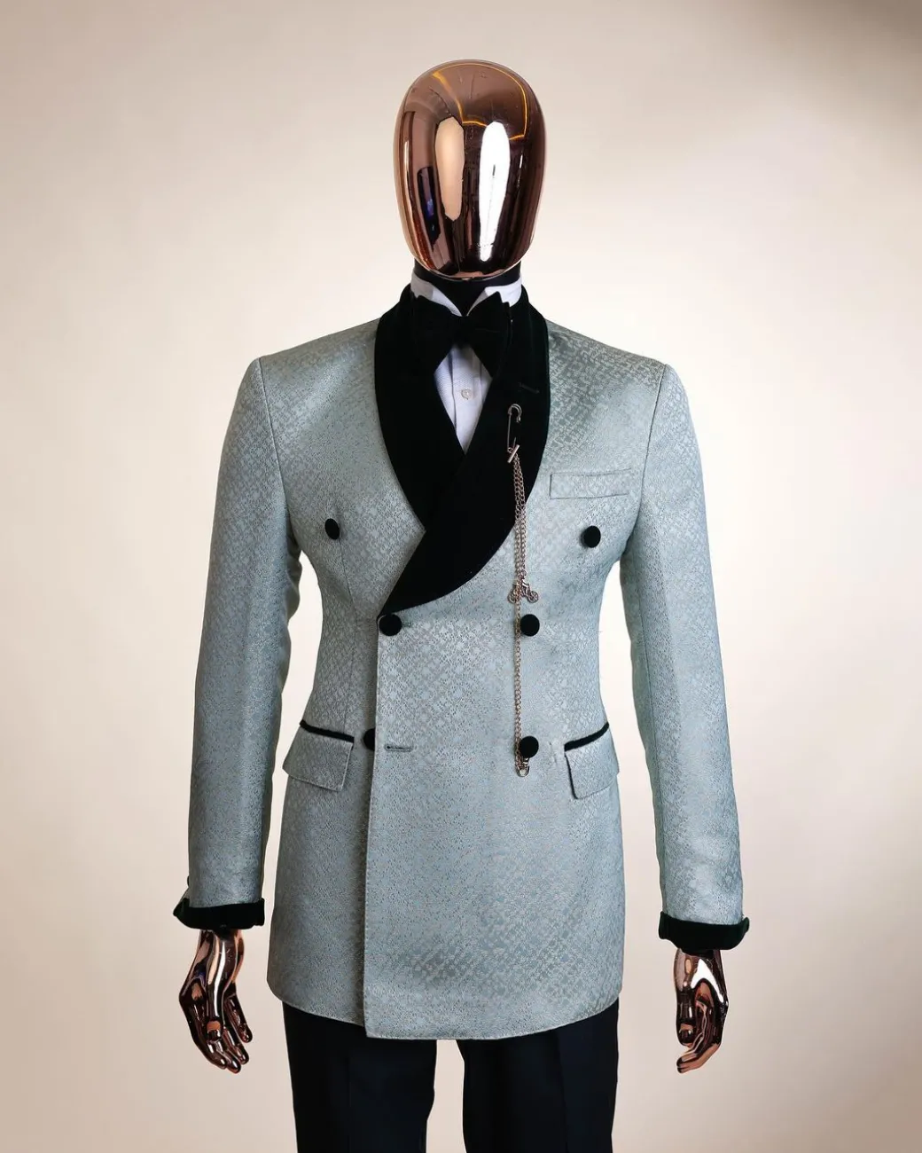 A shawl lapel, Double breathed, pick stitched splashed navy mint green, cream metallic jacquard tuxedo suit