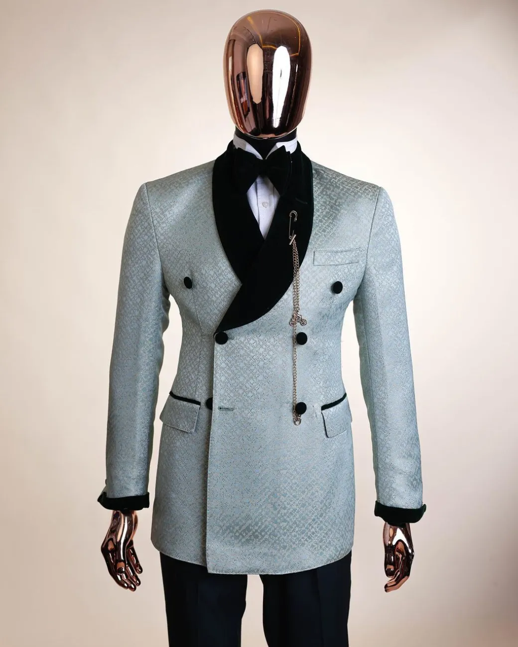 A shawl lapel, Double breathed, pick stitched splashed navy mint green, cream metallic jacquard tuxedo suit