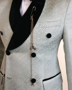 A shawl lapel, Double breathed, pick stitched splashed navy mint green, cream metallic jacquard tuxedo suit
