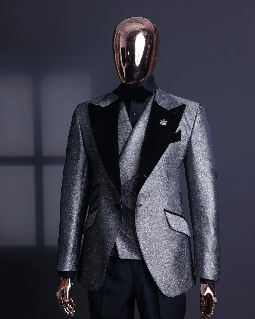 A Silver and black, knitted, jacquard peak lapel tuxedo suit