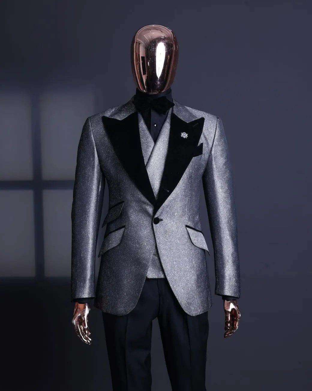 A Silver and black, knitted, jacquard peak lapel tuxedo suit