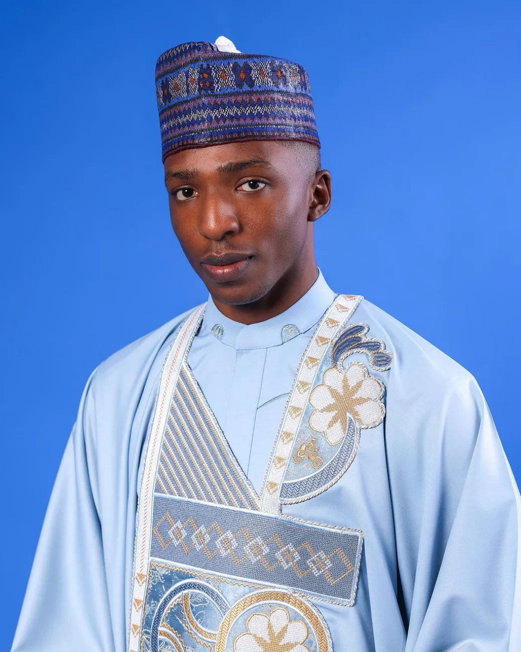 A sky blue galactical embroidery with gold and blue print jacquard details agbada