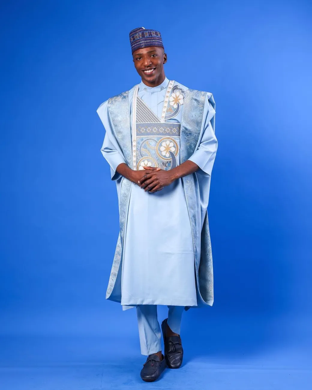 A sky blue galactical embroidery with gold and blue print jacquard details agbada
