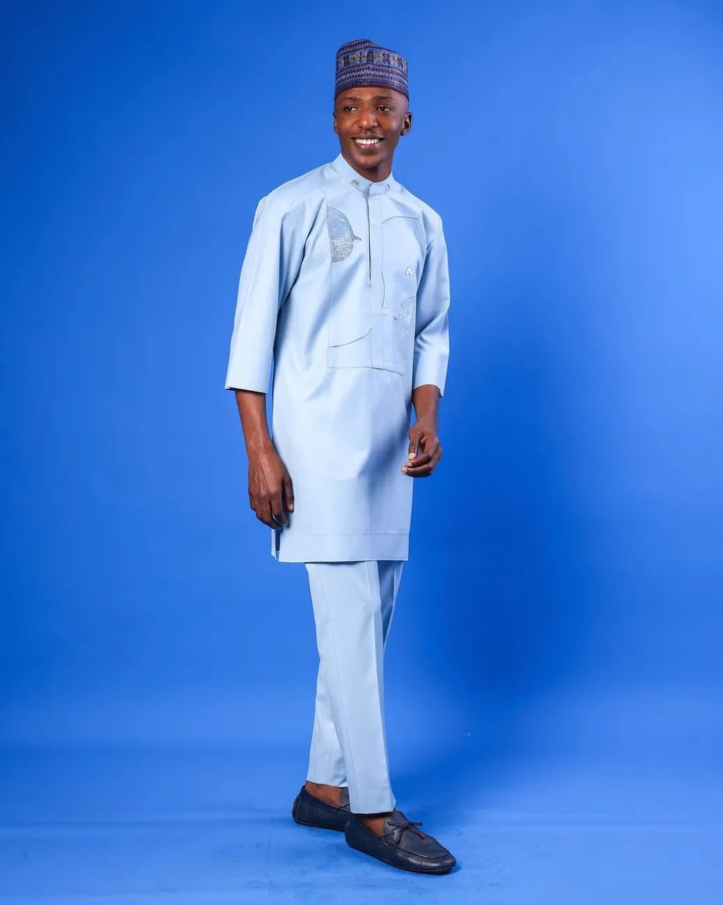 A sky blue galactical embroidery with gold and blue print jacquard details agbada