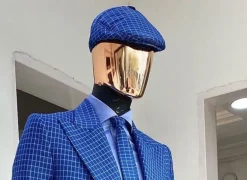 A Skye blue and white check men’s Kangol papas hat.