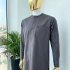 A Space Grey senator with a Swarovski button details African Kaftan