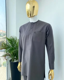 A Space Grey senator with a Swarovski button details African Kaftan