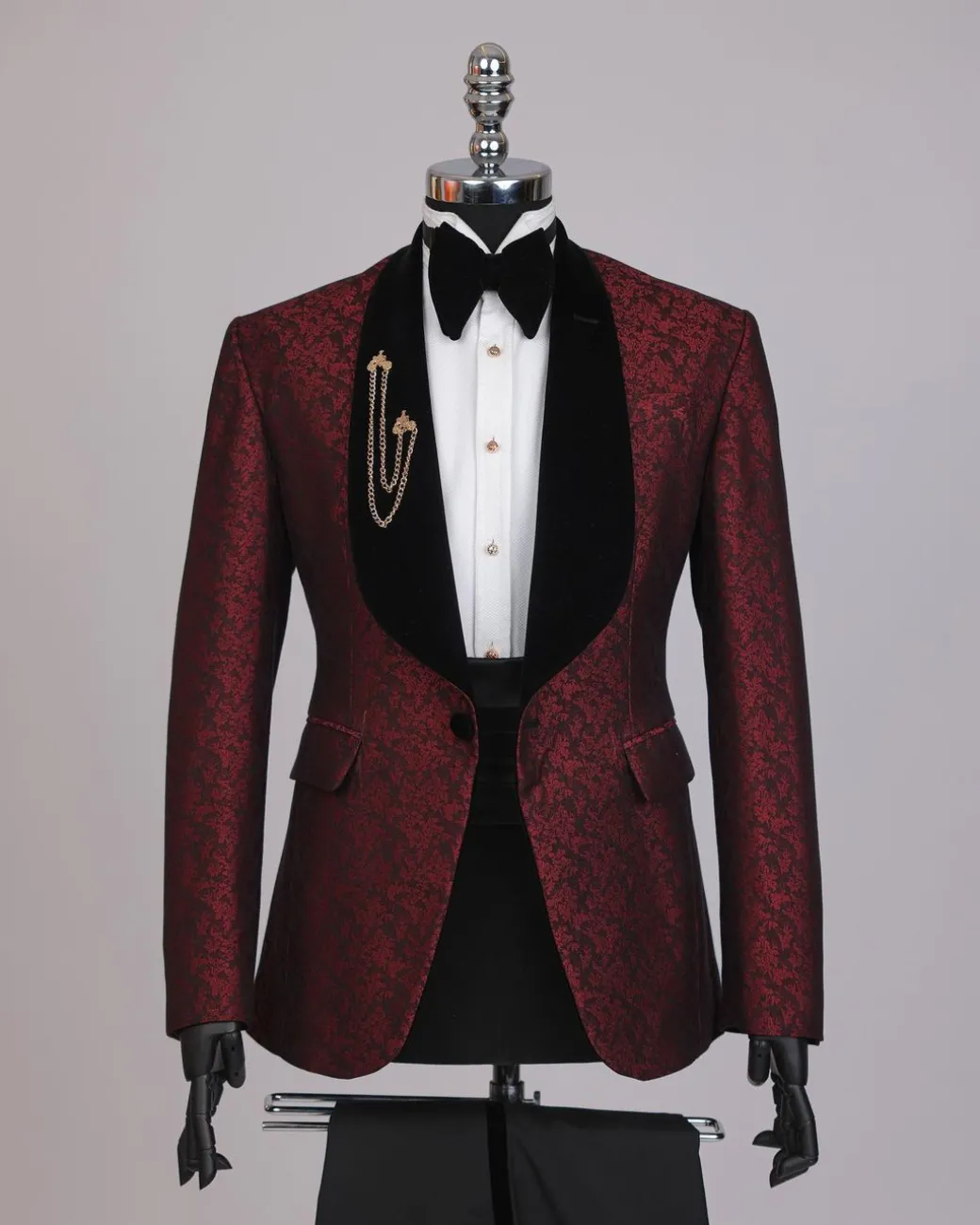 A splash of burgundy and black shawl lapel (black velvet) tuxedo suit