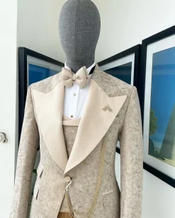 A splash of tortilla and wheat brown peak lapel metallic jacquard tuxedo suit
