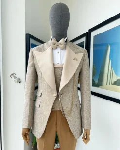 A splash of tortilla and wheat brown peak lapel metallic jacquard tuxedo suit