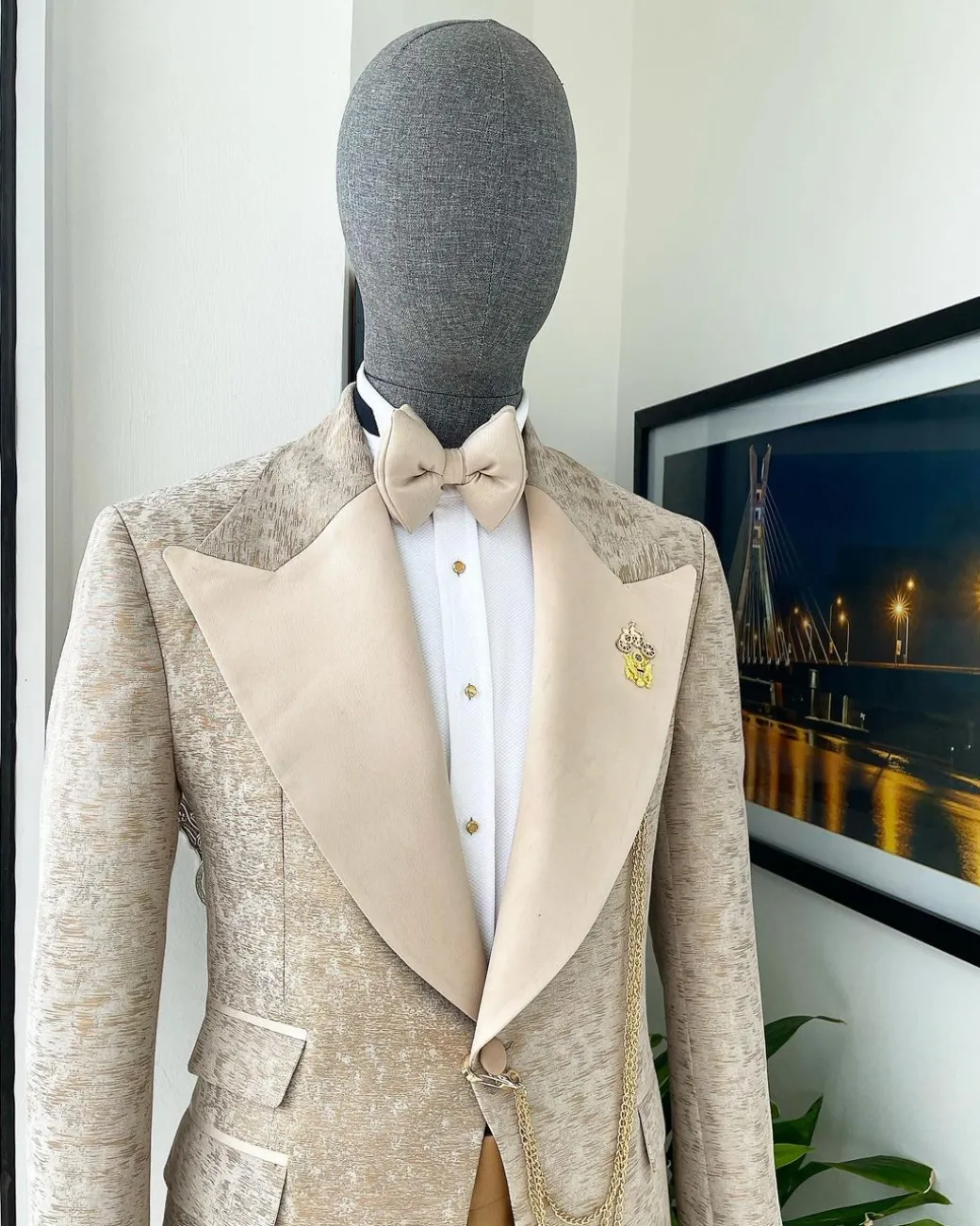 A splash of tortilla and wheat brown peak lapel metallic jacquard tuxedo suit