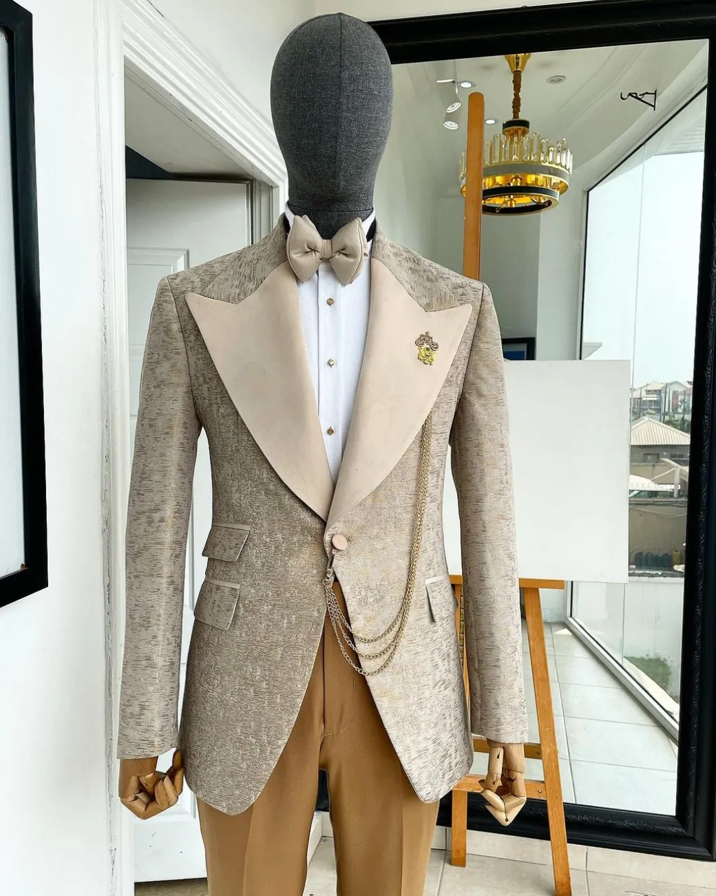 A splash of tortilla and wheat brown peak lapel metallic jacquard tuxedo suit