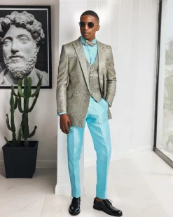 A Splashed gold & turquoise blue metallic jacquard double-breasted suit