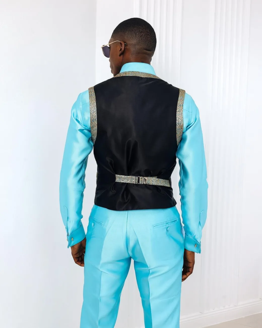 A Splashed gold & turquoise blue metallic jacquard classic waist coat with layered back cut.