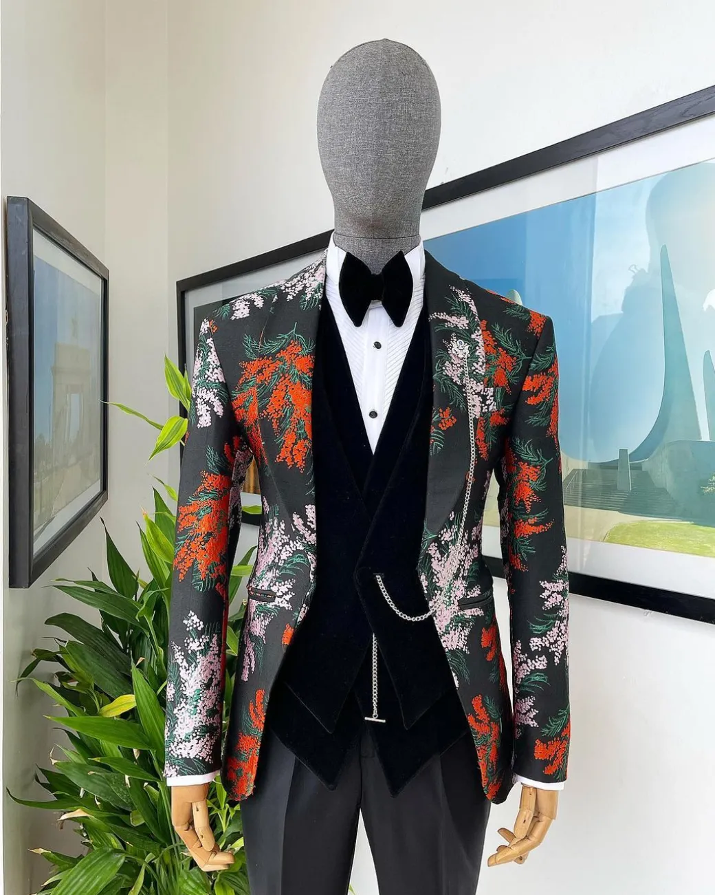 A “spring” orange, pink and green splashed floral layered front cut, shawl lapel tuxedo suit