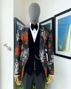 A “spring” orange, pink and green splashed floral layered front cut, shawl lapel tuxedo suit